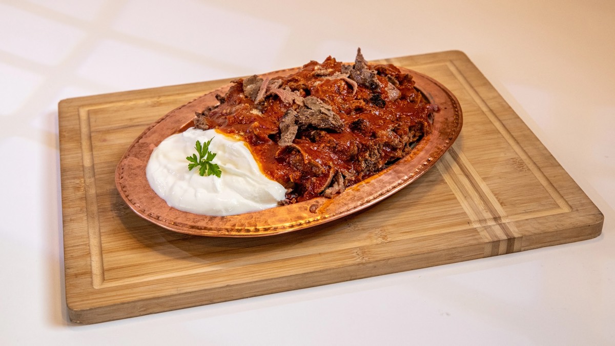 Iskender kebab with tomato sauce and yogurt